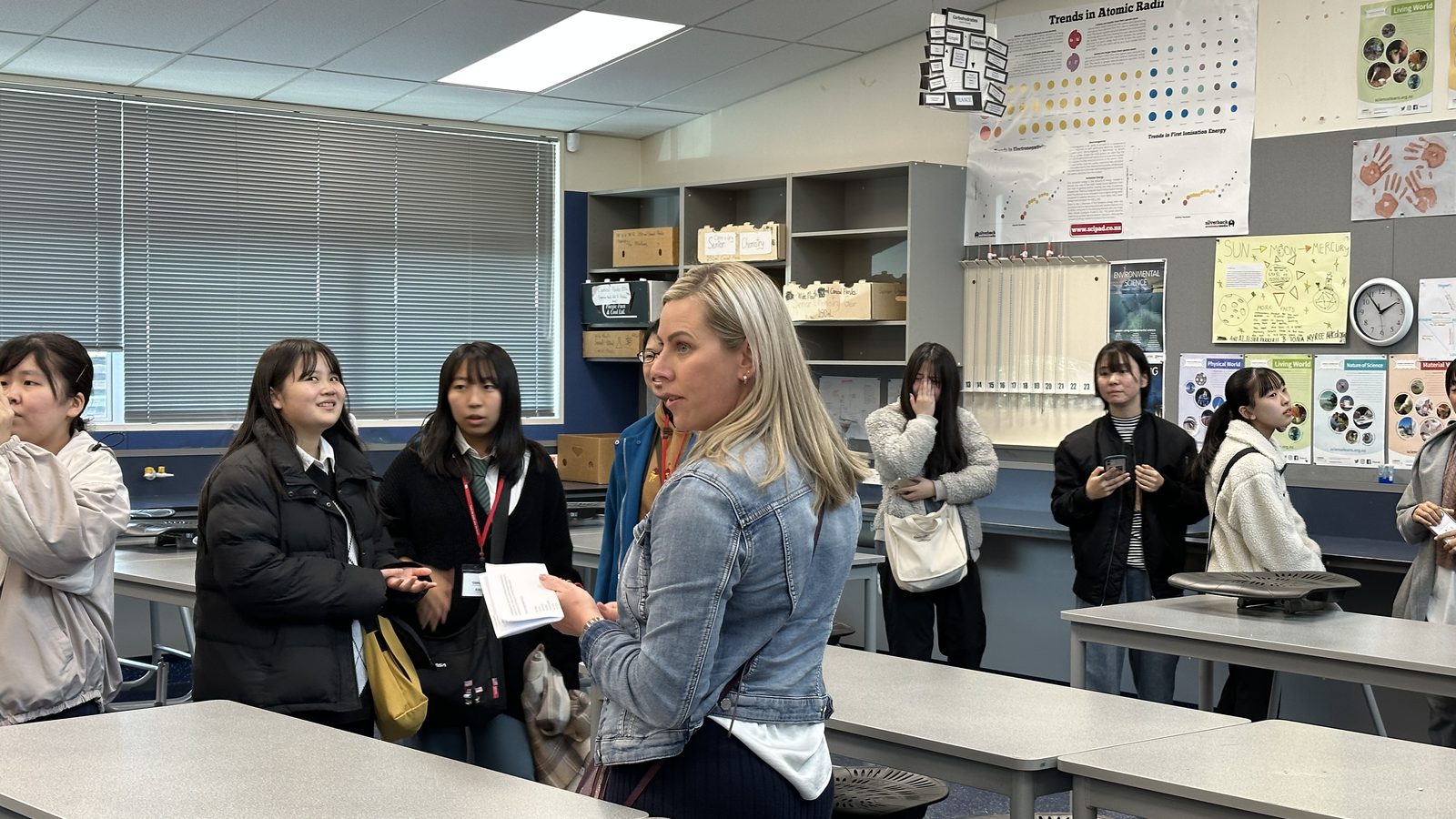 Students and a teacher in a WIE classroom learning activity