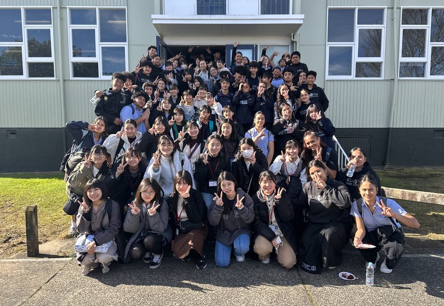 International students outside a school building during a WIE study activity