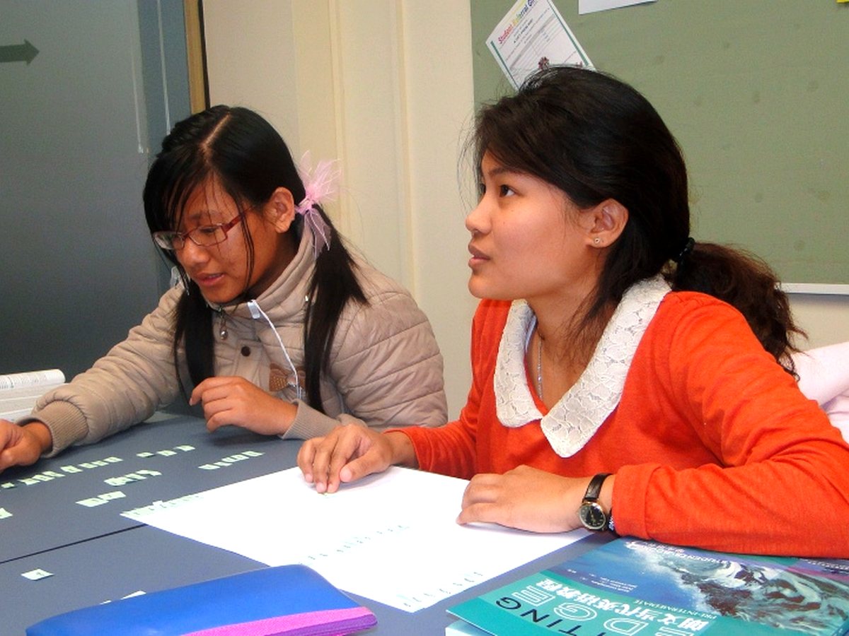 WIE students working through English study materials