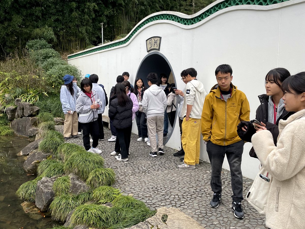 A group of international students on a outdoor excursion at the Hamilton Gardens Chinese Scholar's Garden...