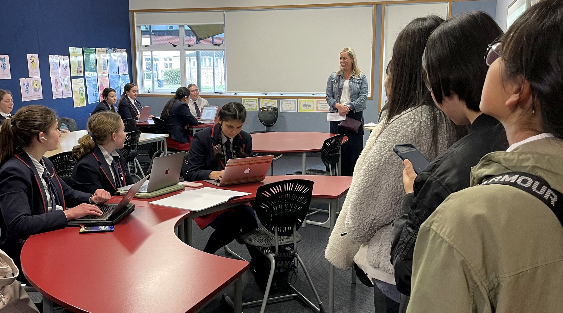 Students working on laptops in a WIE pathway classroom
