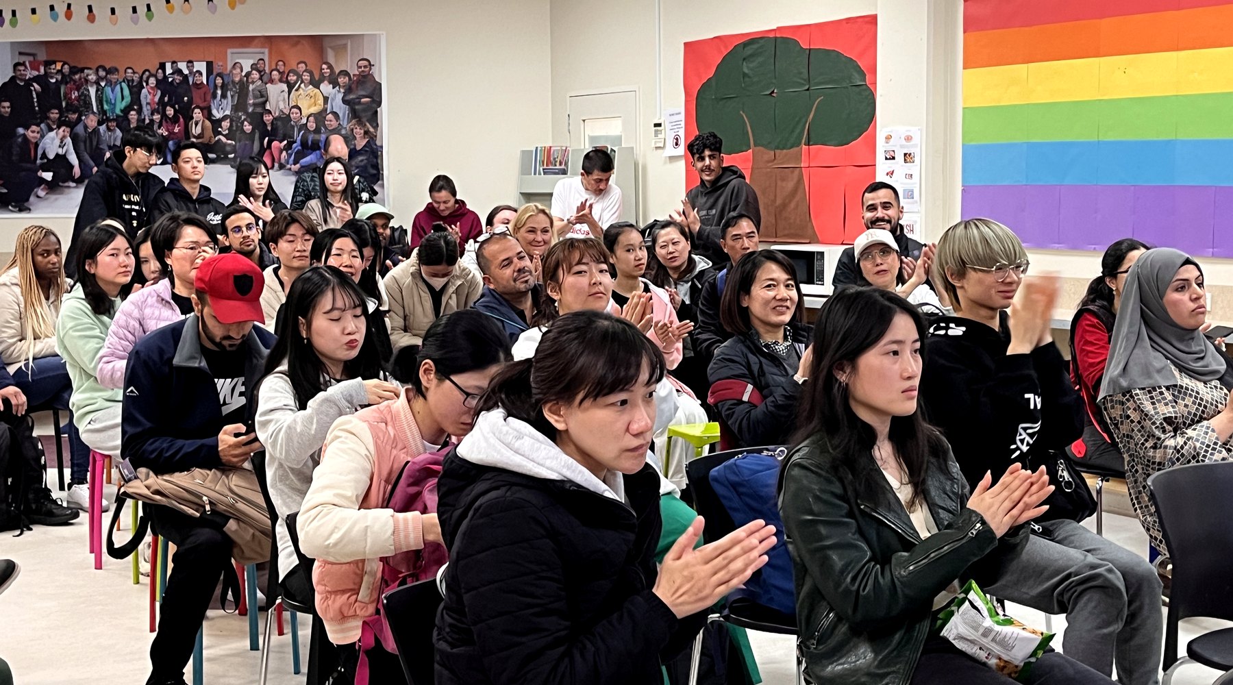 WIE students listening during a classroom presentation